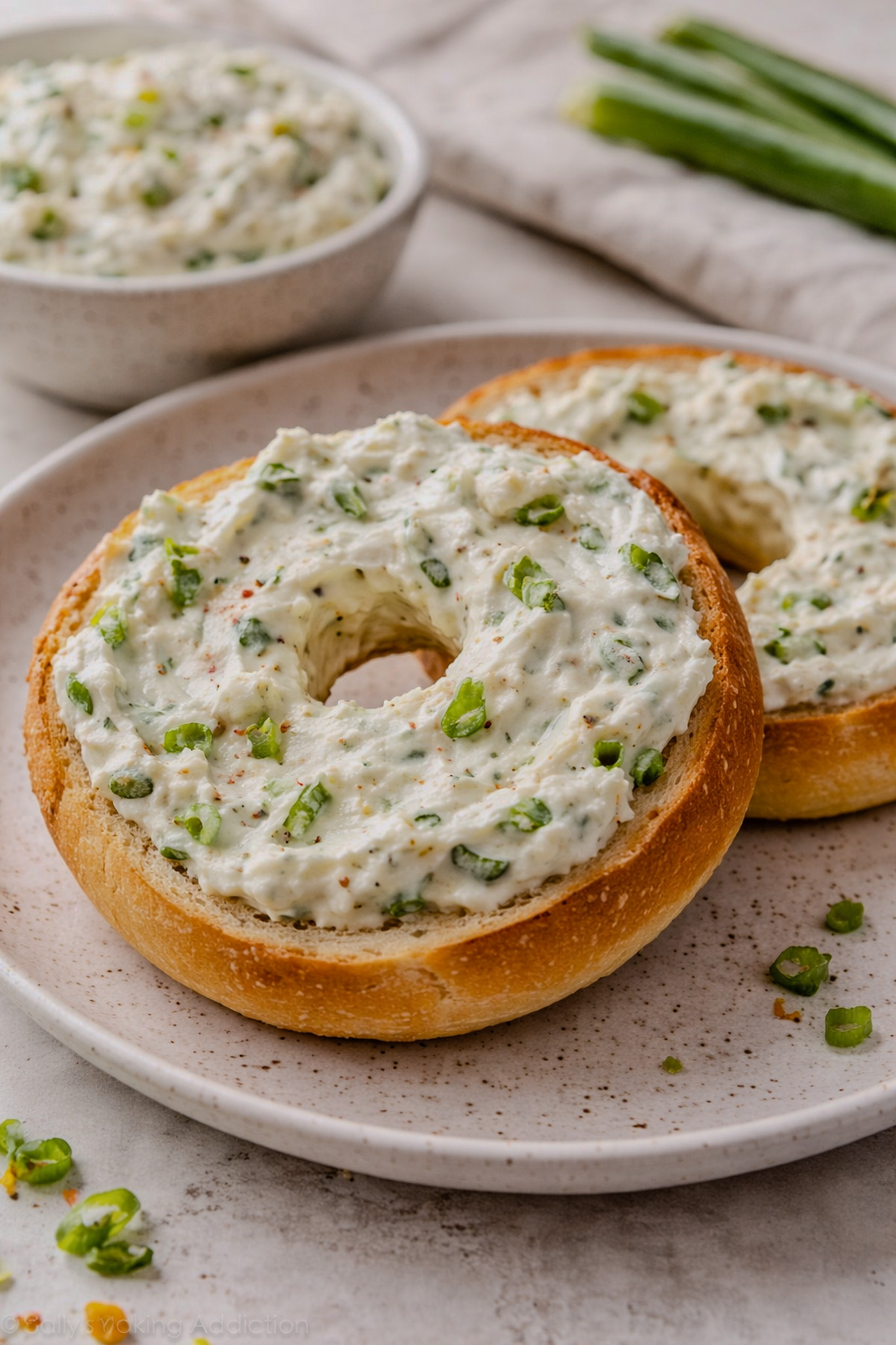 Bowl of homemade scallion cream cheese made with fresh scallions and cream cheese