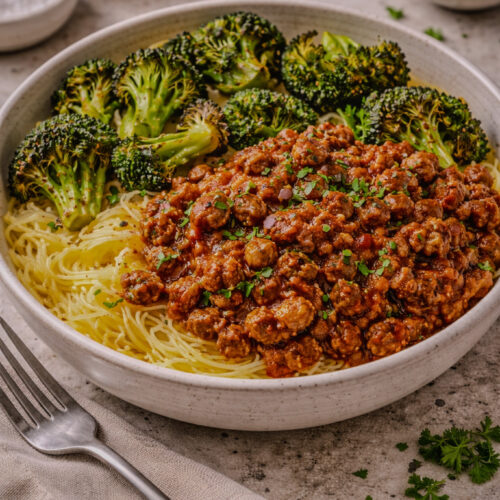 Sloppy Joe bowl served over spaghetti squash with roasted broccoli on the side