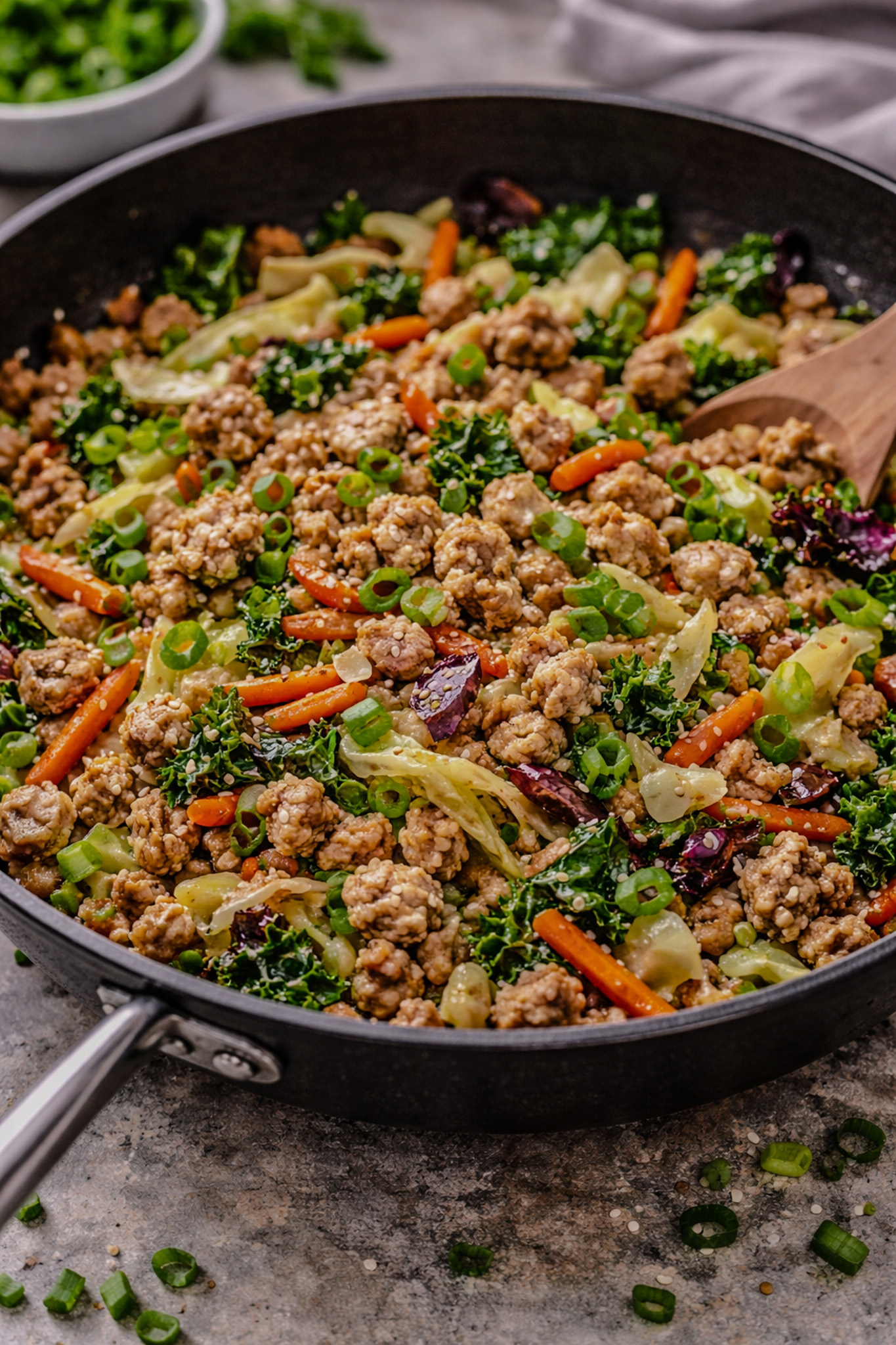 Ground turkey stir fry with ginger, garlic, and Asian vegetables cooked in a skillet